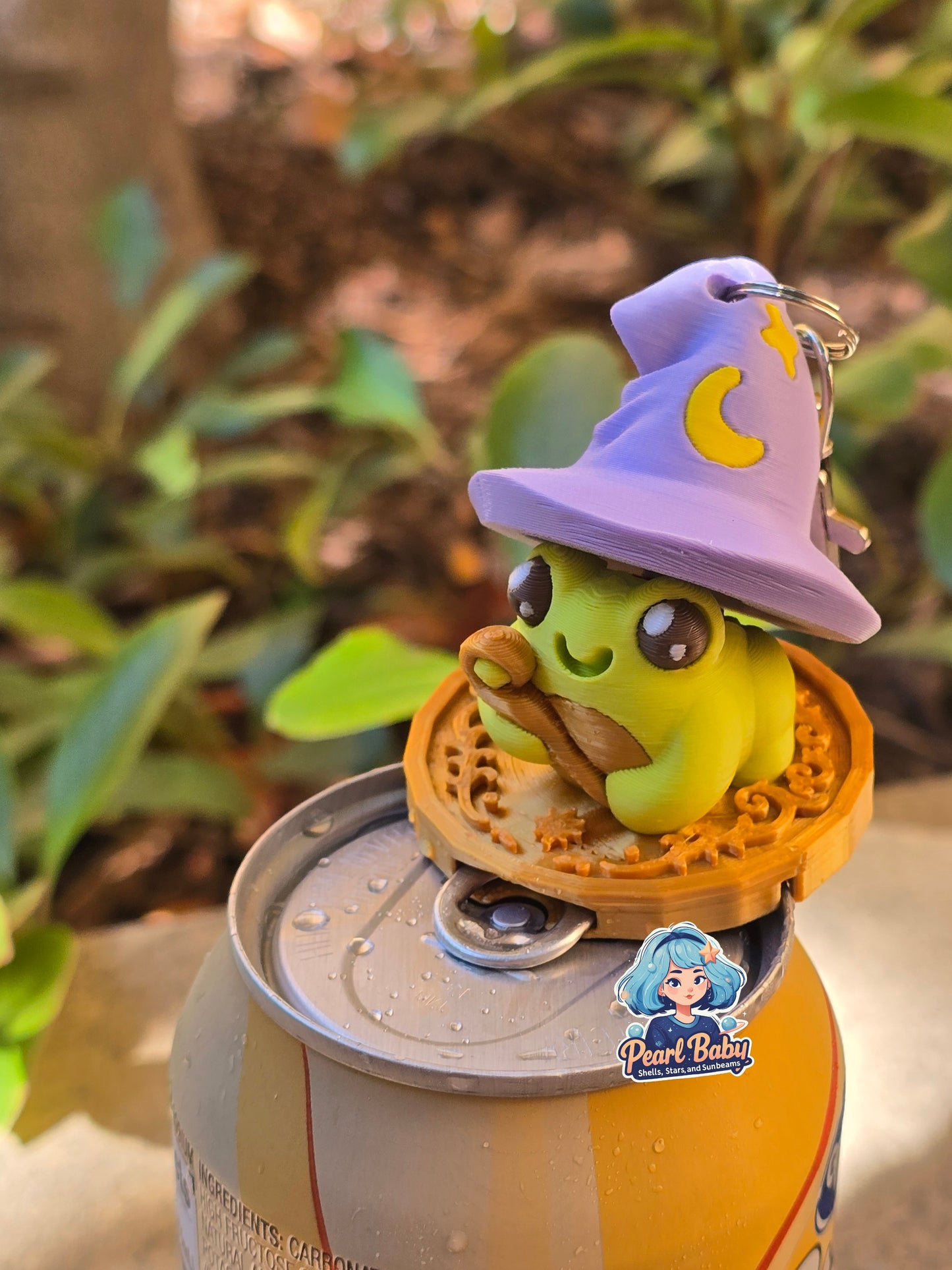 Frog Mage of Fizz sitting on Coin: Fidget with Soda Opener